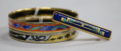 Two Hermes of Paris, gilt metal and enamel bangles (both made in Austria) and a Hermes of Paris