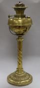 An Edwardian brass oil lamp with later shade