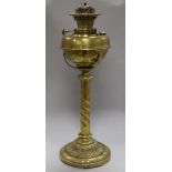 An Edwardian brass oil lamp with later shade