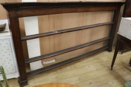 A George III oak plate rack, with dentil cornice and three open shelves, W.7ft 8in. H.4ft 5in.