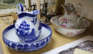 A Doulton Burslem Willow pattern wash jug and basin and a similar Cauldon wash jug and basin