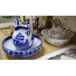 A Doulton Burslem Willow pattern wash jug and basin and a similar Cauldon wash jug and basin