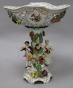 A German floral encrusted porcelain centrepiece, with figural base height 29cm