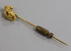A Victorian yellow metal nugget stick pin, 64mm.