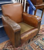 A 1930's tan leather and linenfold carved armchair and a 1940's French tan leather armchair