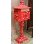 A red cast iron post box W.39cm