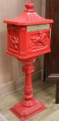 A red cast iron post box W.39cm