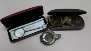 A Halden military compass, a pair of driving glasses and a pair of lorgnettes