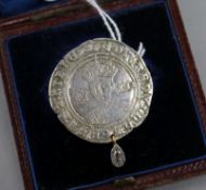 A Medieval coin now mounted as a brooch, with later added diamond drop.