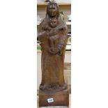 A carved wood figure of the Madonna and child height 60cm