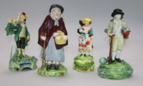 A Staffordshire figure of a gardener by Walton. And three other figures. Height: 16cm