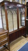 An Edwardian inlaid mahogany two door china display cabinet W.129cm