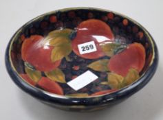 A Moorcroft pomegranate pattern bowl Diameter 26cm.