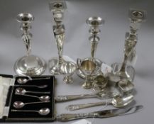 Two pairs of silver pillar candlesticks, three silver napkin rings, etc. the candlesticks to include