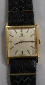 A 18ct gold Omega dress wrist watch with square dial, on leather strap.