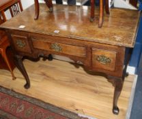 A mid 18th century oak lowboy, fitted three small drawers, on cabriole supports