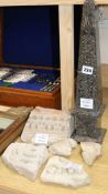 A black variegated marble obelisk and five Ancient carved marble Roman / Greek fragments obelisk