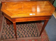 A George III satinwood banded mahogany card table, with canted sides W.94cm