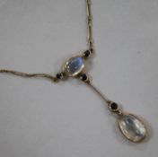 An early 20th century yellow metal, moonstone and sapphire drop necklace, drop section 48mm.