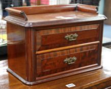 A small Victorian mahogany two drawer chest, with three quarter gallery top W.40cm