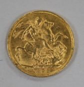 An Edward VII 1905 gold full sovereign.