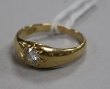 An 18ct gold and gypsy set solitaire diamond ring, size S.