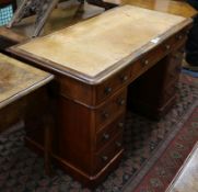 A Victorian mahogany pedestal desk, fitted nine small drawers W.119cm