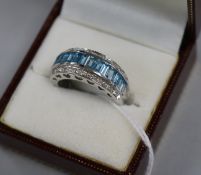 A modern 14ct white gold, aquamarine and diamond set triple row half hoop dress ring, size Q.