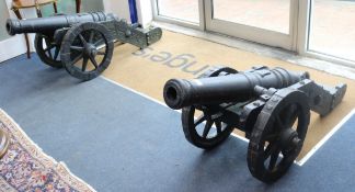 A pair of cast iron model cannons W.60cmFrom the estate of the late Sheila Farebrother.