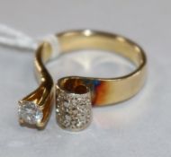 A yellow metal and solitaire diamond ring, with textured setting, size J.