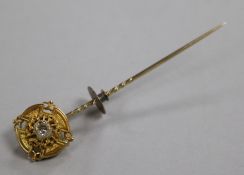 A Victorian yellow metal and solitaire diamond sick pin, 73mm.