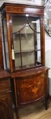 An Edwardian marquetry inlaid bowfront china display cabinet, the base enclosed by panelled door