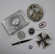 A German Iron Cross 1st class, an SS lapel badge number 792, dagger lapel pin, German army belt