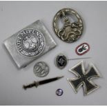 A German Iron Cross 1st class, an SS lapel badge number 792, dagger lapel pin, German army belt