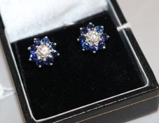A pair of modern 18ct white gold, sapphire and diamond cluster ear studs, approx. 11mm.