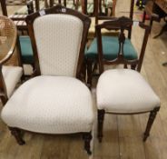 A late Victorian mahogany framed nursing chair, with cream upholstery and a similarly upholstered
