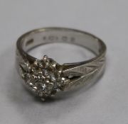 An 18ct white gold and diamond cluster ring, size O.From the estate of the late Sheila Farebrother.