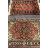 A Tabriz silk red ground medallion rug and another pink ground rug 144 x 102cm and 125 x 85cm