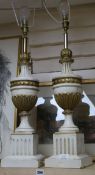 A pair of cream and gilt carved wood table lamps, on square bases, various glassware, tea cups etc,