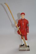 A Sitzendorf figure, modelled as 'Waterman Dogget Winner' height 26cm