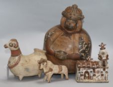 Peruvian pottery: a Nazca style flask, a Llama shaped vessel, a model of a church and a model of a