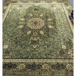 A Wilton broadloom Persian design green ground carpet 317 x 276cm