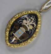 A George III chased yellow metal mourning choker necklace clasp with vase of seed pearl flowers