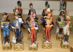 A set of twelve Capo di Monte Napoleonic Wars military figures and a figure of an Old Guard standard