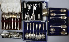 Four cased sets of silver flatware, a silver mustard and a collection of loose spoons etc.