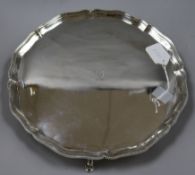 A Scottish George V silver presentation salver, of shaped circular form with bead edge on three