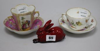A Meissen floral painted cup and saucer, a Dresden two handled cup and saucer and a Royal Doulton