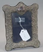 An early 20th century repouse silver mounted photograph frame, 20.5cm.