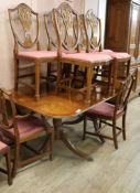 A set of eight Hepplewhite style mahogany dining chairs and a Regency style mahogany two pillar