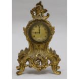 A small Louis XV style gilt cast metal eight day mantel timepiece 20cm.